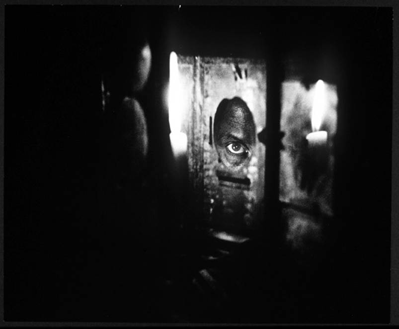 Egons Spuris eye and a candle